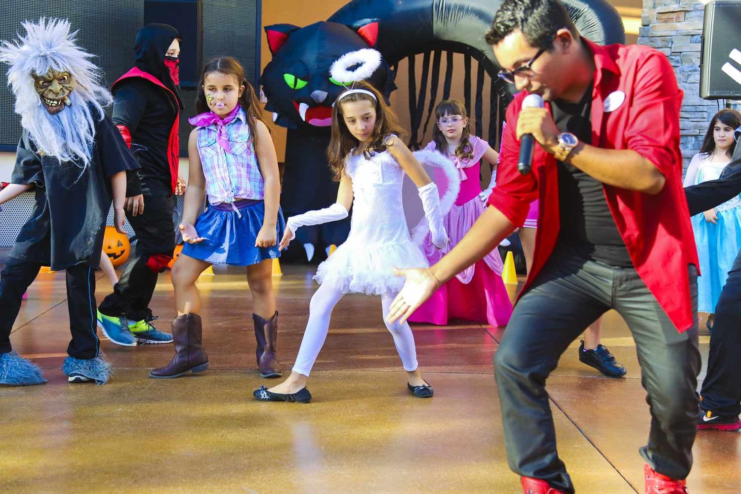 Kids dancing in Halloween costumes